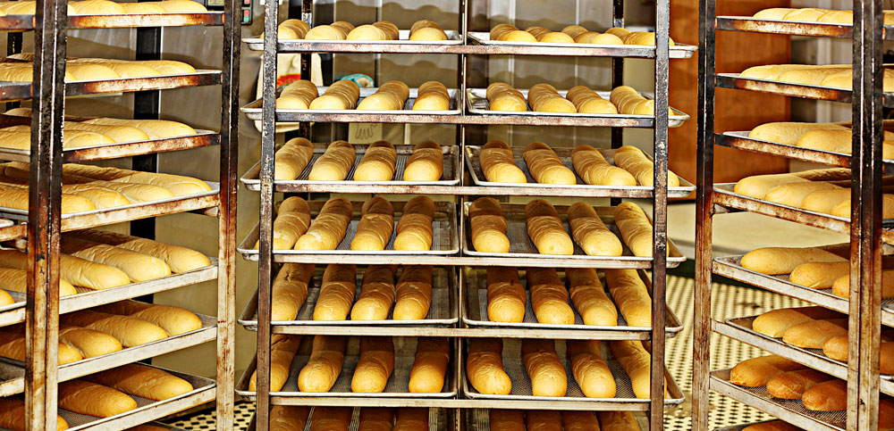 Sub Rolls cooling on racks at Em's Bakery